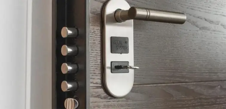 Commercial locksmith servicing a storefront door in Tacoma, WA