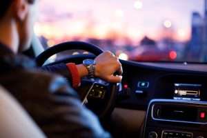 Peak Locksmith technician opening a locked car door without damage for a driver in Tacoma WA