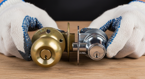 Old and new door lock cylinders side by side for a rekey versus replace decision in Tacoma WA