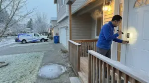Peak Locksmith technician checking a dead keypad deadbolt on a frosty morning at a Pierce County, WA home